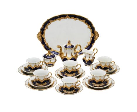  Meissen B Form. Gold and cobalt tea and coffee service for six persons. Includes coffee pot, creamer, sugar bowl, tray, 6 cu