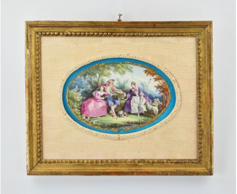 An oval-shaped French porcelain panel with a gallant scene of a 19th-century walk in a park. The shepherd and the shepherdess