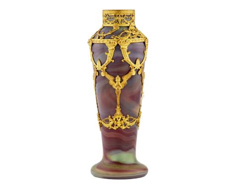  A unique vase made of agate glass and decorated with gilded fittings. Decorative overlays hug the modern body of the vase wi