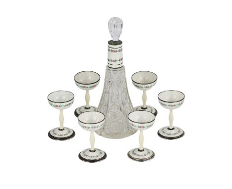 A cute liqueur set for six people, with a crystal bottle with a silver, guilloche neck and a crystal stopper. With 6 glasses,