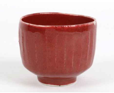 David Leach (British, 1911-2005) Bowl copper red porcelain with cut sides impressed potter's seal 7.5cm high, 8.7cm diameter.