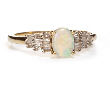 OPAL AND DIAMOND RING, the central cabochon opal flanked by tapered baguette cut diamonds to the shoulders, in nine carat gol