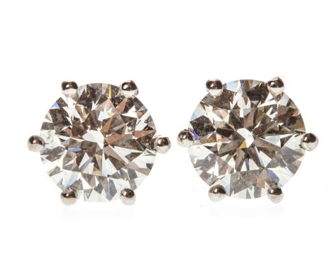 PAIR OF DIAMOND STUD EARRINGS, each set with a round brilliant cut diamond of approximately 1.70 carats, marked 750 to the po
