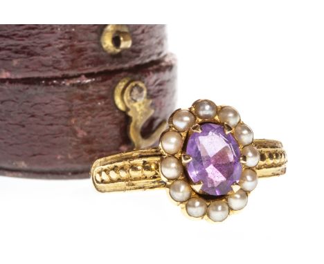 VICTORIAN AMETHYST AND SEED PEARL RING, the central six claw mounted oval faceted amethyst within a halo of seed pearls, with