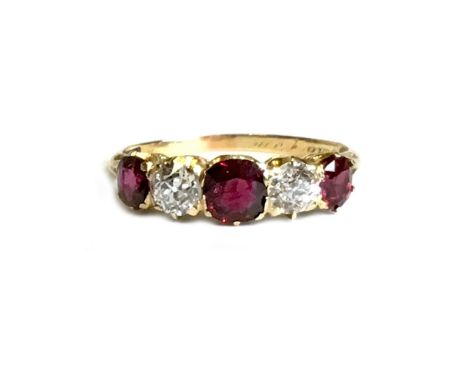 LATE VICTORIAN NATURAL RUBY AND DIAMOND RING, set with three graduated cushion shaped natural rubies, the central gem 4.6m wi