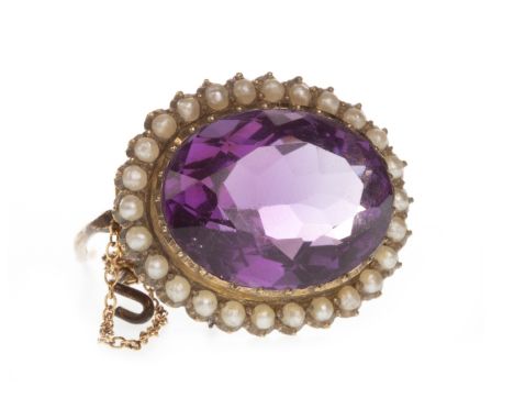 AMETHYST AND SEED PEARL BROOCH, set with an oval faceted amethyst within a border of seed pearls, 23mm long, unmarked, 5.5g