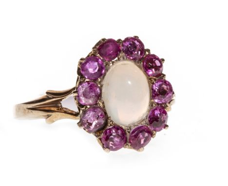 EARLY TWENTIETH CENTURY OPAL AND GEM SET CLUSTER RING, the central cabochon opal surrounded by round pink gems, unmarked, siz