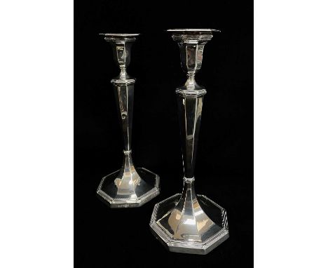 PAIR GEORGE V SILVER CANDLESTICKS, Sheffield 1927, of octagonal section, beaded rims, loded bases, 26cm h (2)