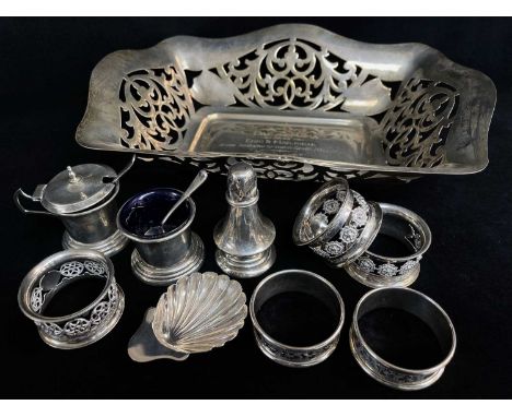 GROUP OF SILVER TABLEWARE, comprising George VI pierced bread basket with engraved inscription dated 1938, 28cm w, three piec