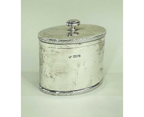 GEORGE V SILVER TEA CADDY, Goldsmiths &amp; Silversmiths Co., London 1911, oval with engraved scrolling bands, 11cm w, wt. 10