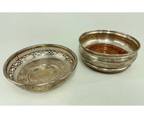 SILVER PIERCED CIRCULAR BON BON DISH together with silver and turned wooden bottle coaster, Birmingham hallmarks (2)Provenanc