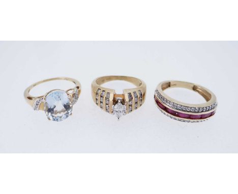 THREE MODERN 14K GOLD DRESS RINGS, comprising diamond and ruby triple row ring, diamond ring, and believed aquamarine and dia