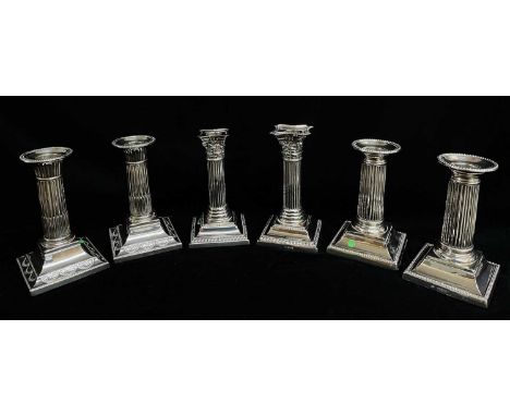 THREE PAIRS SILVER DWARF CANDLESTICKS, 1894-1923, with fluted, stop fluted and reeded columns, loaded bases, all about 14.5cm