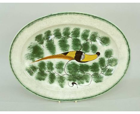 LATE 18TH/EARLY 19TH CENTURY PEARLWARE MEAT PLATTER, naively painted with a peacock or pheasant in a spongework bough, feathe