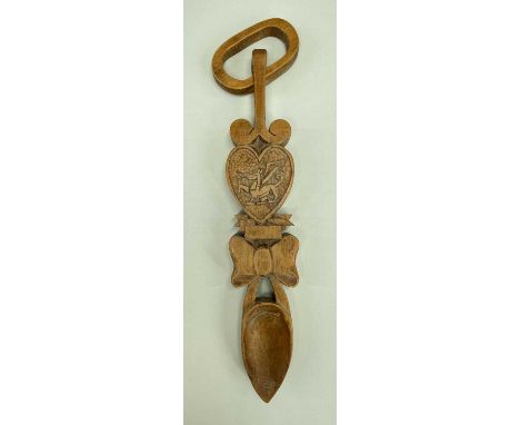20TH CENTURY SOUVENIR LOVE SPOON carved with Welsh dragon and ribbon, ring to loop terminal30cmsComplete, without damage or r