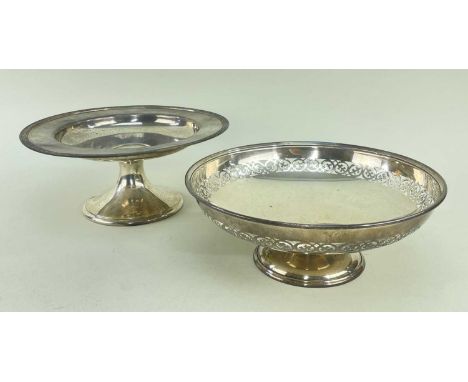 TWO SILVER COMPORTS, one with pierced border, 25cms diam., the other American silver by Gorham Co., and with laurel leaf bord