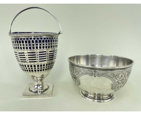 TWO SILVER ITEMS comprising late Victorian silver pierced sugar-basket, having swing handle raised on square base with blue g