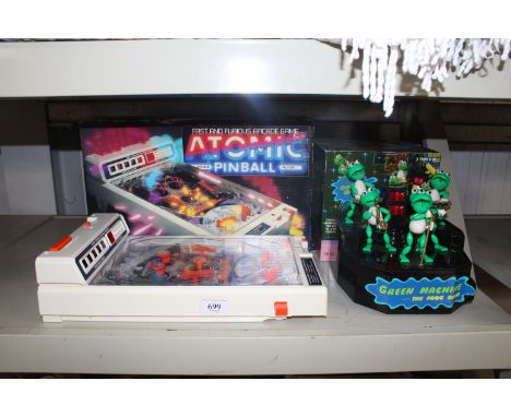 A Tomy Atomic Arcade pinball machine together with a Green Machine 'The Frog Band'