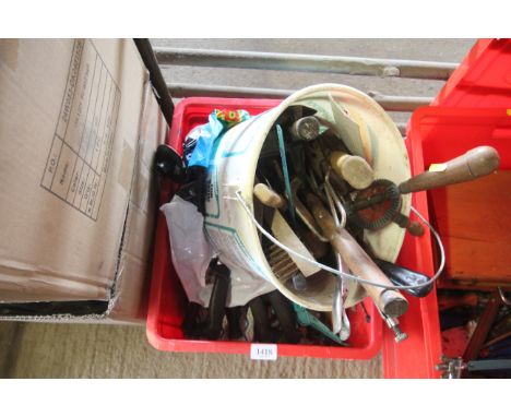 A box containing various tools to include hand brace, mallet, hammers, wire brushes, screwdrivers etc.