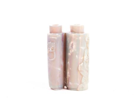 A Chinese pale green iridescent, carved jade double snuff bottle in the form of two cylindrical vases with flautist and lions