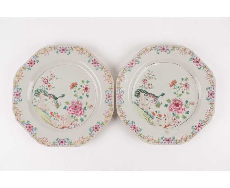 A pair of Chinese famille rose octagonal plates, late 18trh century, painted with a peacock and peahen in a garden setting, s