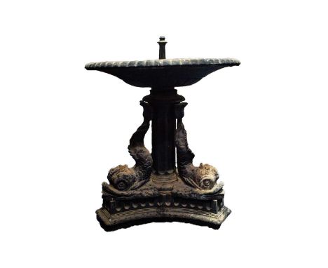 An early 19th century style, heavy cast lead fountain with scallop molded circular top with a heavily molded edge. Supported 