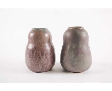 A pair of 1920s Upchurch pottery double gourd vases with streaked matt glaze, bearing impressed factory marks to the bases, 1