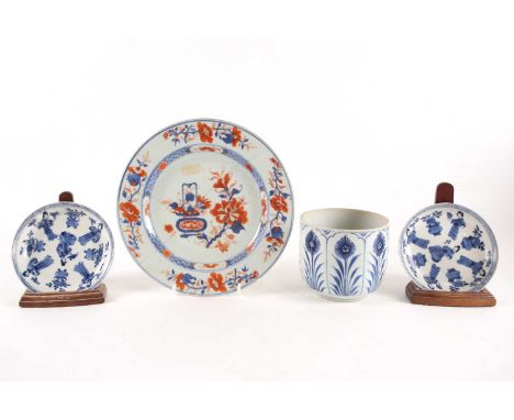A pair of Chinese blue &amp; white saucers, Kangxi, each finely potted, painted with five females holding either a bird or fl