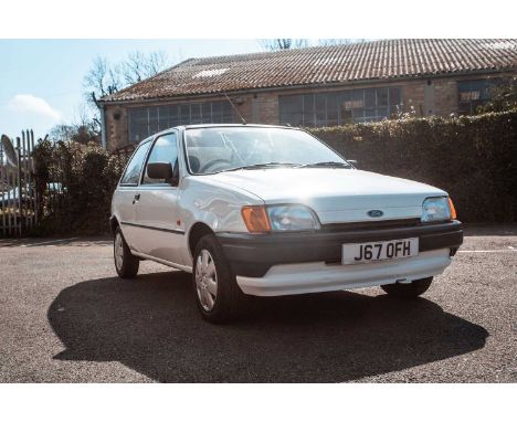 A 1992 Ford Fiesta Bonus white 3-door manual hatchback. 1.1cc petrol. Registration J67 0FH. First registered 16/03/92. Near-f