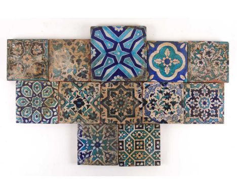 Twelve Persian Isnik tiles, 19th century, principally floral designs, most 15.5cm square, large tile 20.5cm sqCondition repor