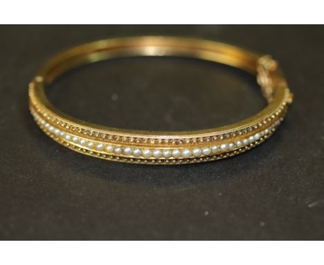 Yellow metal &amp; seed pearl bangle