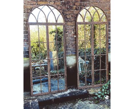 ARCHITECTURAL WALL MIRRORS, a pair, regency style metal arched frames, 180cm H x 75cm. (2) 