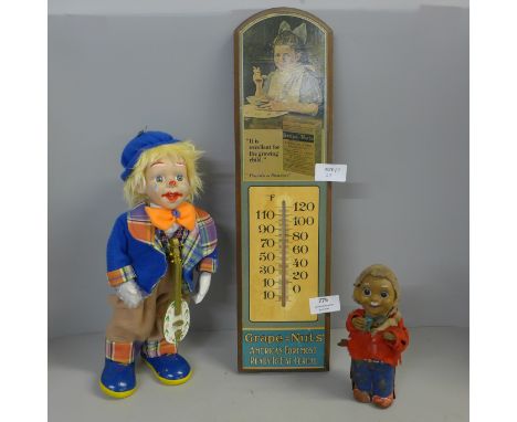 A wind-up musical clown, a clockwork tin plate bartender and a Grape-Nuts advertising sign with thermometer 