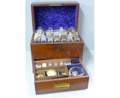 A 19th Century mahogany apothecary chest/box with campaign handle, includes sixteen fitted bottles, a set of scales, various 