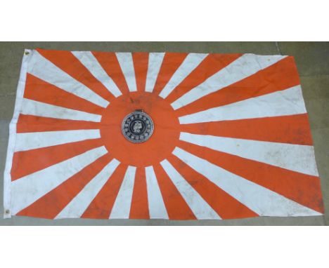 A Brandenburg Gate Berlin plaque and a Rising Sun flag, a/f 