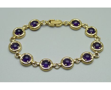 A silver gilt, cabochon amethyst bracelet 