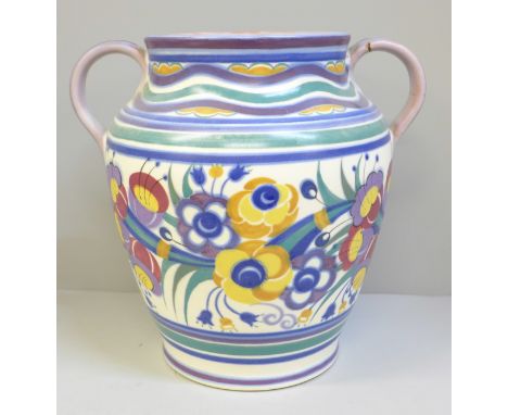 A Poole pottery vase, twin handles, decorated with leaves and flowers, one handle restored, 22.5cm, one handle a/f 