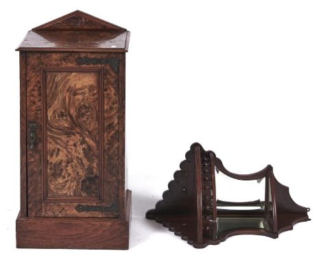 A Victorian burr walnut veneered pot cupboard, c1880, with roundel carved triangular back, panelled door and skirted plinth, 