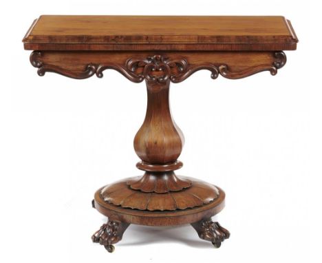 A Victorian rosewood card table, c1850, on octagonal pillar and round lappeted base with paw feet, 74cm h; 44 x 89cm  