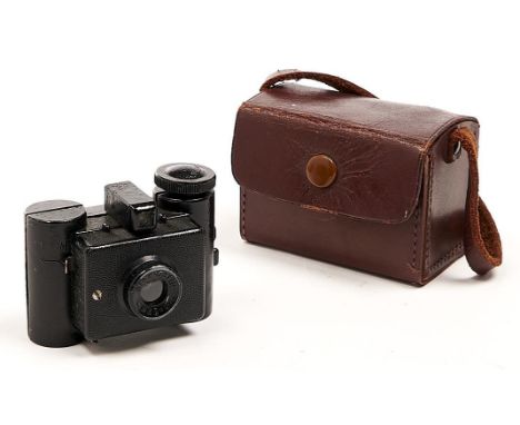 A Sida black painted cast metal sub miniature roll film camera, c1936, with F8 35mm meniscus lens, maker's printed leaflet an