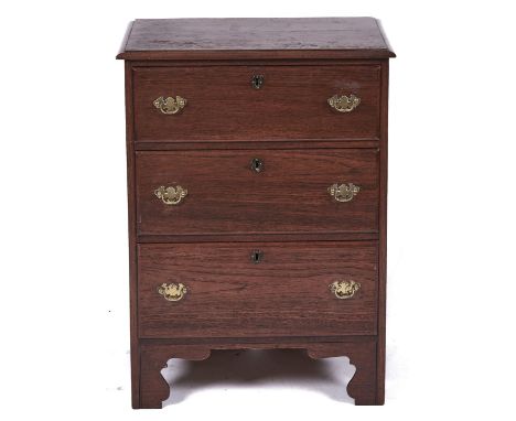 A reproduction oak chest of drawers, the rectangular top above three drawers, shaped bracket feet, 82cm h; 60cm w  Water mark