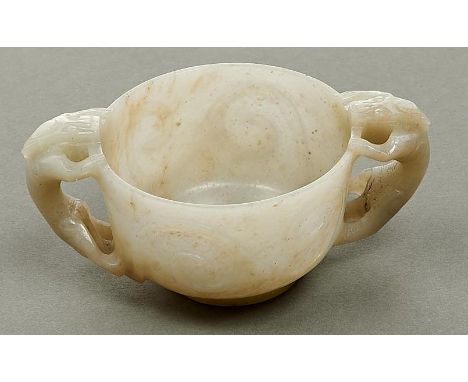 A Chinese jade libation cup, 20th c,&nbsp;carved with chilong handles, 11.5cm over handles  Good condition