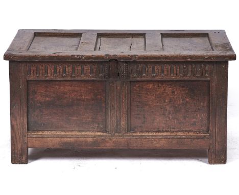 An oak chest, elements 18th c, with three panel lid, two panel front and knulled frieze, on channelled styles, 110cm l  Shrin