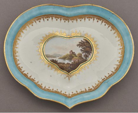 A Derby kidney shaped dessert dish, c1800-10, painted with a gentleman resting before a lake landscape in turquoise and gilt 
