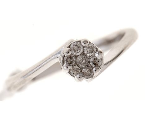 A diamond cluster ring, in 18ct white gold, Birmingham, millesimal mark, 2.8g, size L½  Good condition