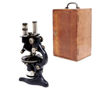 A brass and iron compound binocular microscope, E Leitz, Wetzler ,No186629,&nbsp; focusing by rack work, with several eyepiec