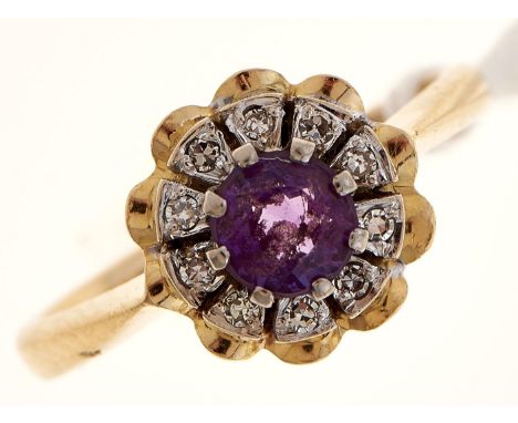 An amethyst and diamond cluster ring, in 18ct gold, Birmingham 1990, 4.5g, size I  Good condition