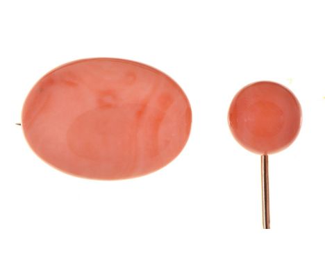 A gold stick pin,&nbsp; with coral bead terminal and a coral brooch mounted on a gold pin, 10.1g (2)  Both in good condition