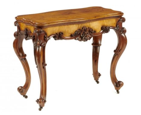 A Victorian serpentine carved walnut and grained rosewood card table, c1870, 76cm h; 49 x 93cm  