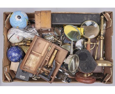 Miscellaneous scientific bygones and decorative objects, to include two microscopes, a oronet camera, three globes, magnifyin